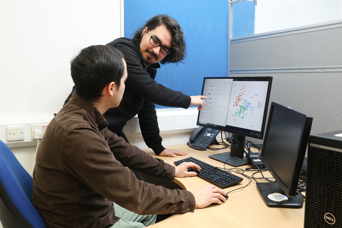 fellowship student at desk in the Clinical Research Facility, Galway