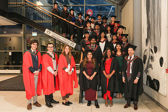 Graduation photo of the class on stairs